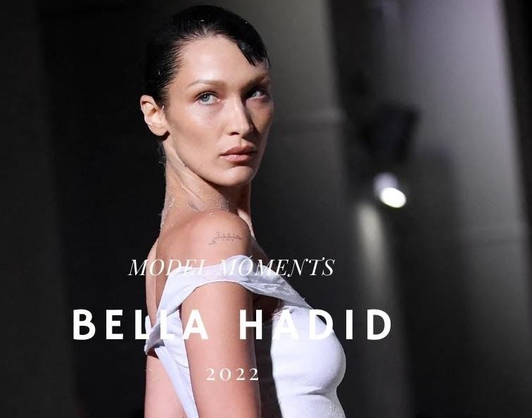 Bella Hadid na wybiegu podczas pokazu mody, prezentująca efektowną stylizację.